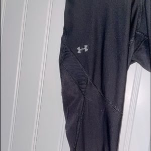 Black Under Armor leggings, mesh on the lower leg.